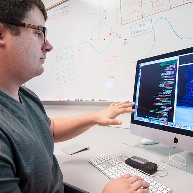 Student works on a 3D simulation of a hand