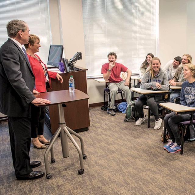 President George W. Bush speaks to a class