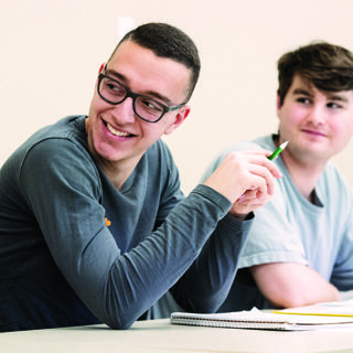 Two male students in class